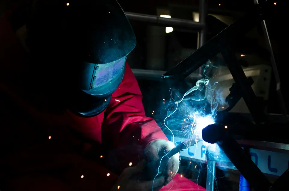 a welder working on a piece of metal